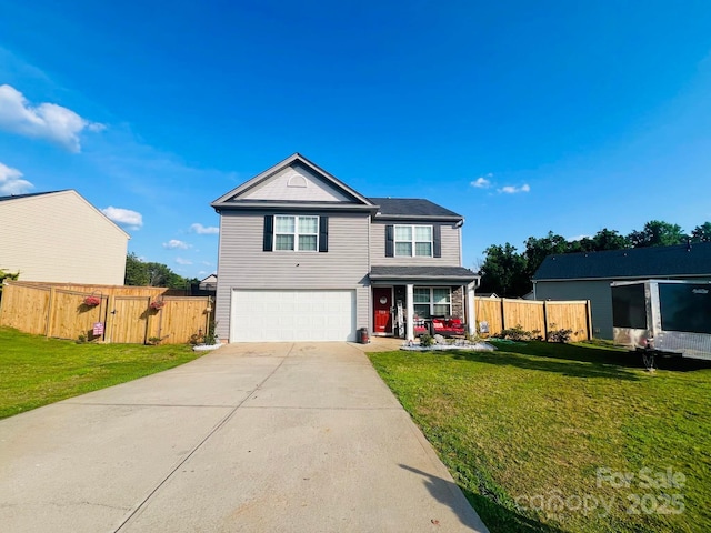 view of property featuring a front lawn and a garage