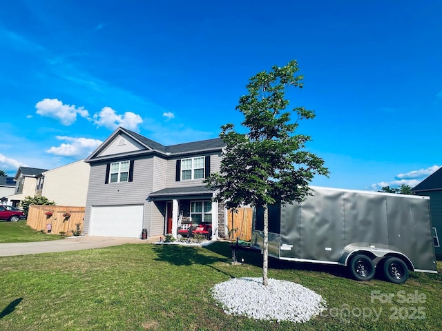 view of front of house featuring a front yard and a garage