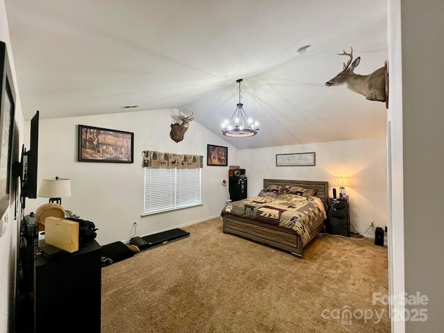 bedroom featuring lofted ceiling, an inviting chandelier, and carpet flooring