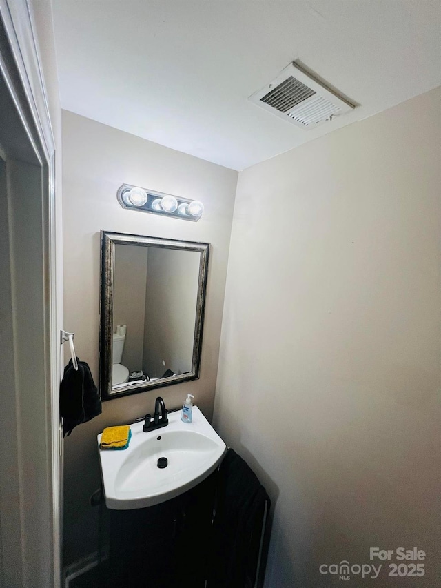 bathroom with toilet and sink