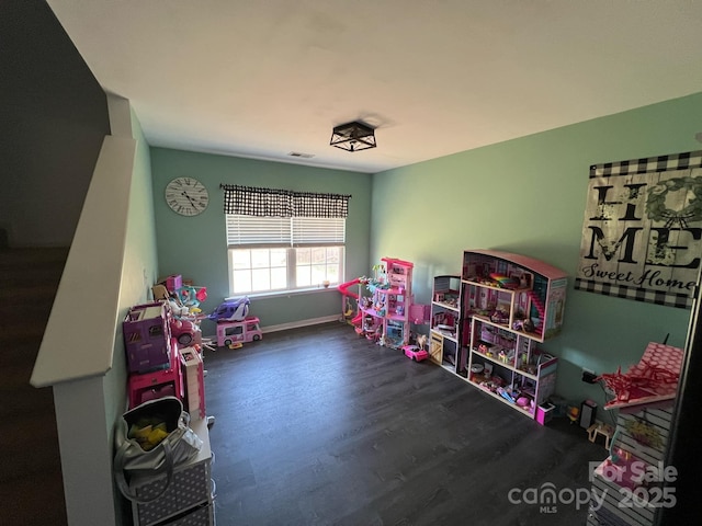 playroom featuring baseboards, visible vents, and wood finished floors
