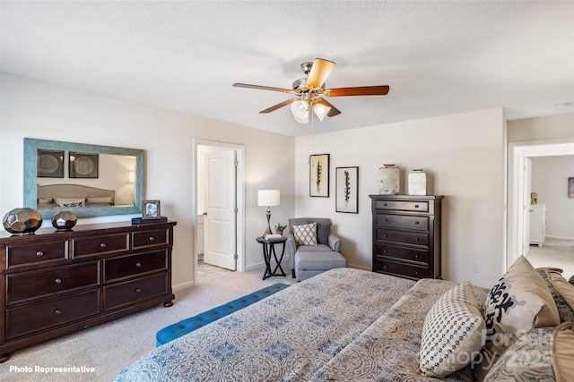 bedroom featuring light carpet and ceiling fan