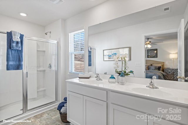 bathroom with vanity, ceiling fan, and walk in shower