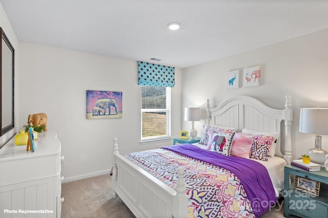 bedroom featuring light colored carpet