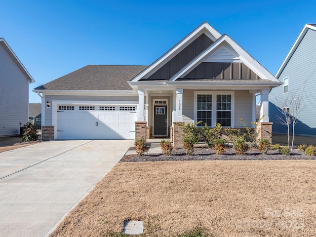 craftsman inspired home featuring a porch and a garage