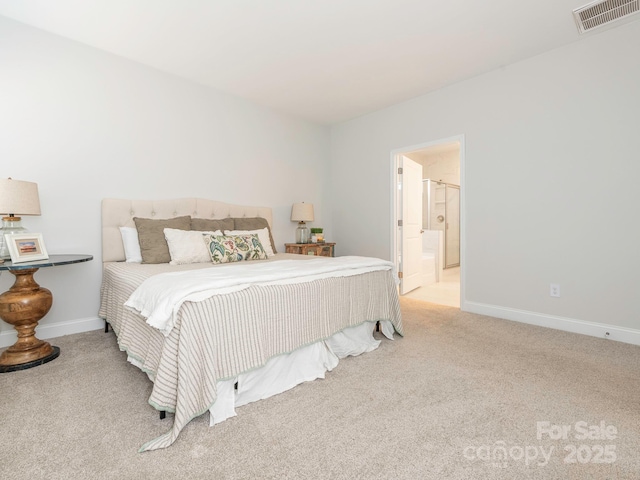 carpeted bedroom with ensuite bathroom