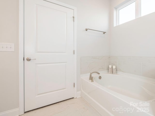 bathroom with a tub