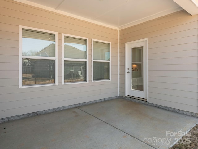 entrance to property with a patio area