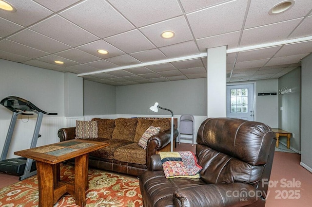 living room featuring a paneled ceiling