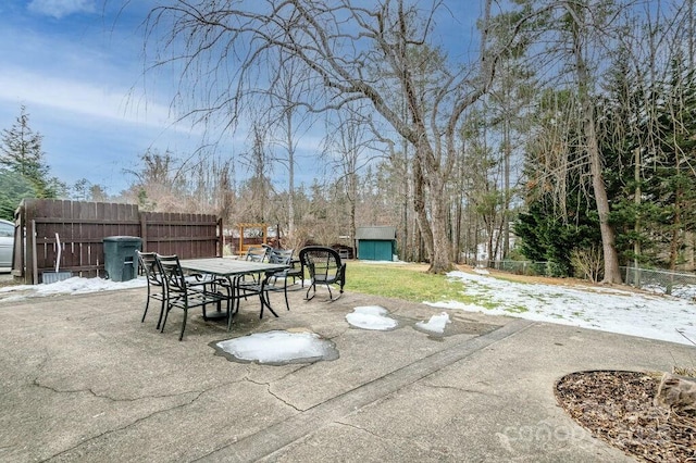 view of patio / terrace featuring a storage shed