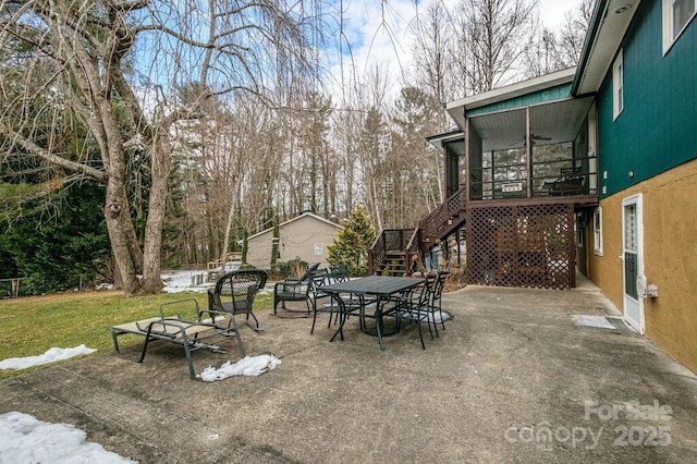 view of patio / terrace featuring ceiling fan