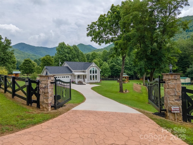 exterior space with a mountain view and a yard