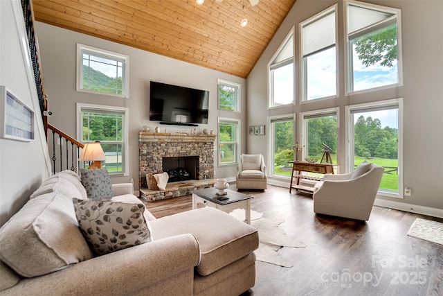 living room with wooden ceiling, a fireplace, dark hardwood / wood-style floors, and high vaulted ceiling