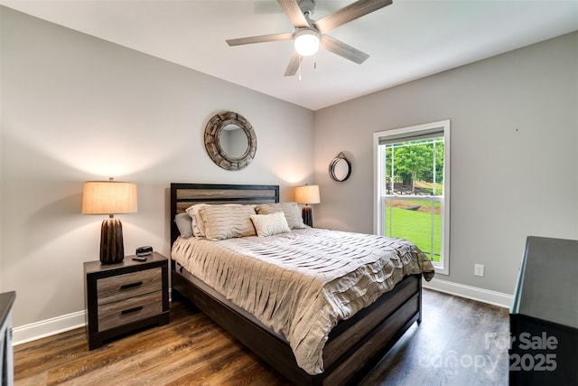 bedroom featuring ceiling fan and dark hardwood / wood-style flooring