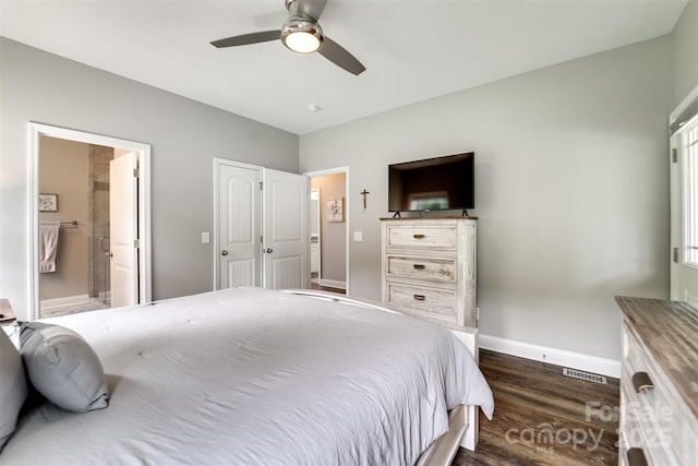 bedroom with ceiling fan, dark wood-type flooring, and ensuite bathroom