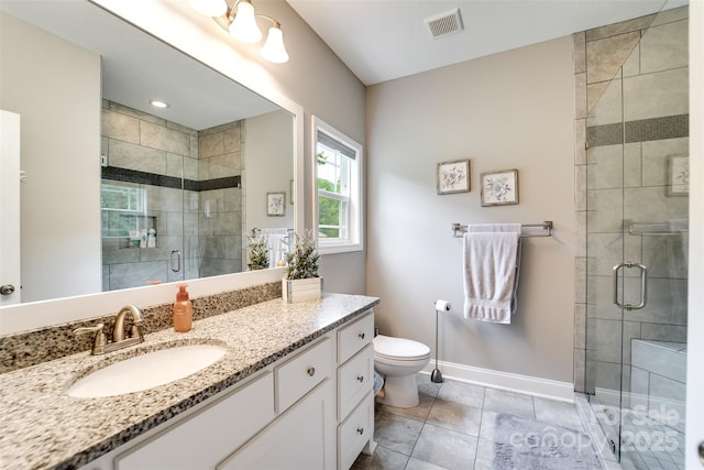 bathroom with toilet, tile patterned flooring, walk in shower, and vanity