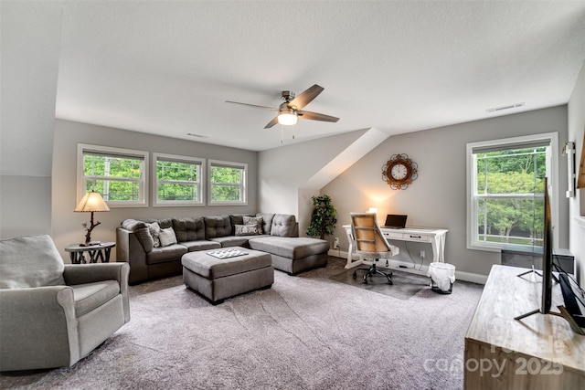 living room with ceiling fan and carpet