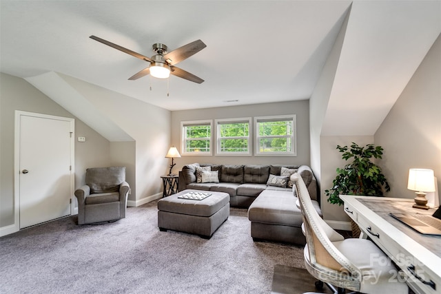 carpeted living room with ceiling fan and lofted ceiling