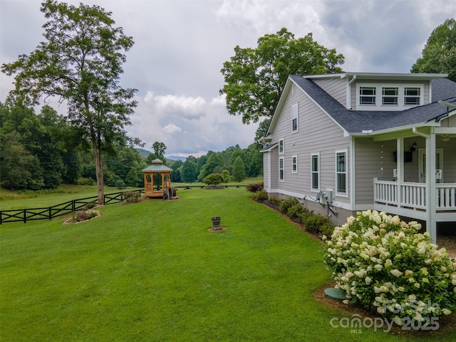 view of yard featuring a playground and covered porch