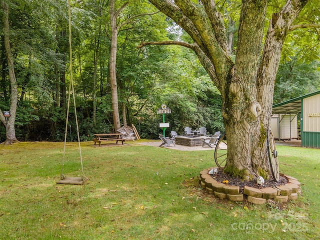 view of yard with a patio area and a fire pit