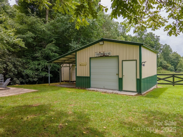 view of outbuilding with a garage and a lawn