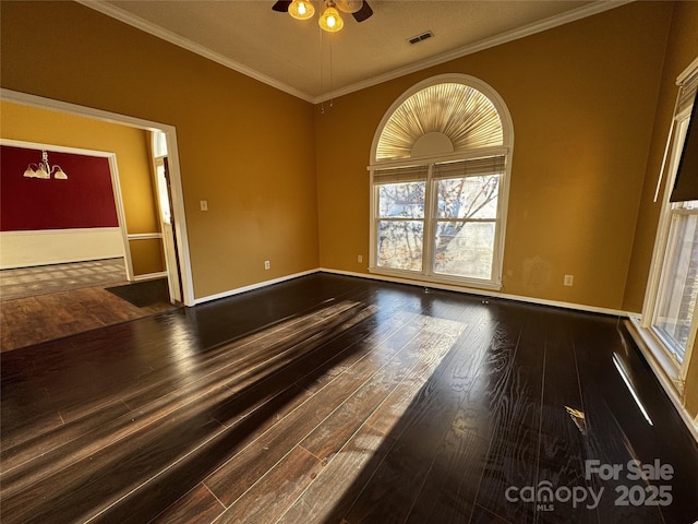 spare room featuring crown molding, ceiling fan, and dark hardwood / wood-style floors