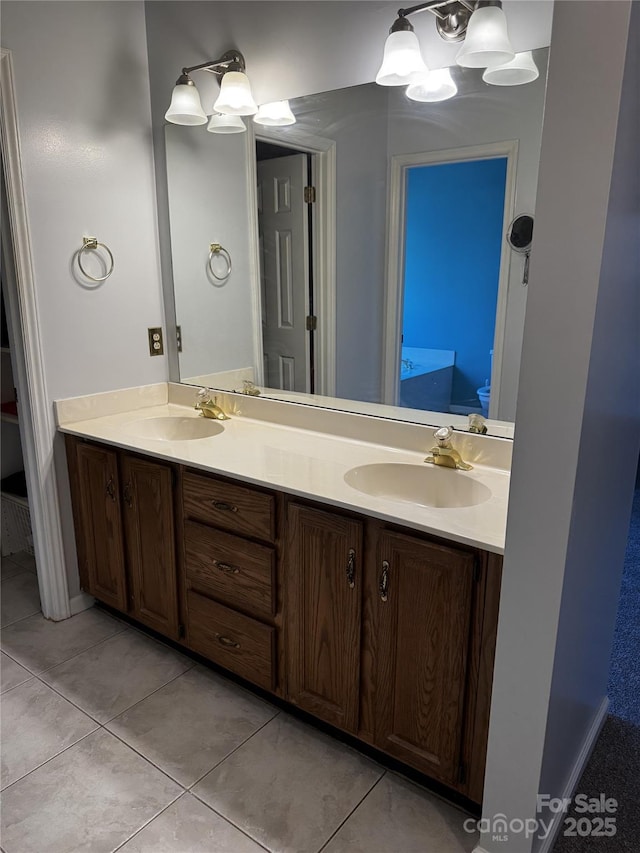 bathroom featuring tile patterned flooring and vanity