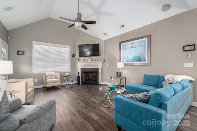 living room featuring ceiling fan, dark hardwood / wood-style floors, and lofted ceiling