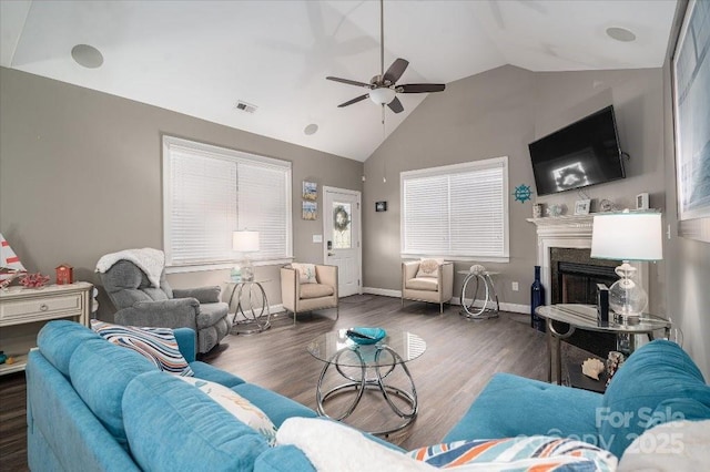 living room featuring ceiling fan, dark wood-type flooring, and lofted ceiling