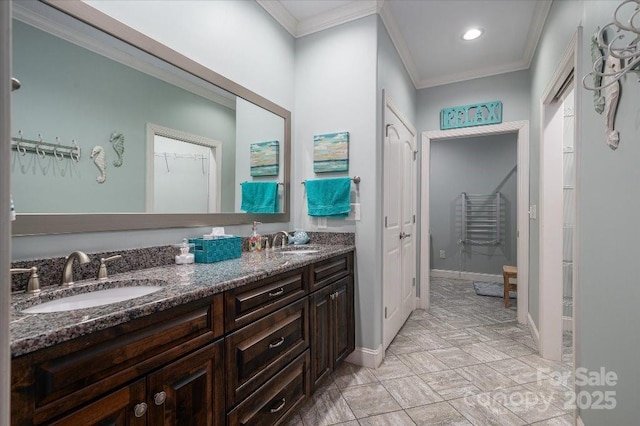 bathroom with vanity and crown molding