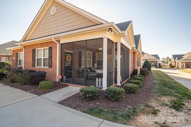 view of front of property with a sunroom