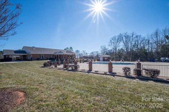 view of yard with a fenced in pool