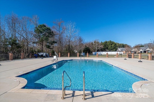 view of pool featuring a patio area