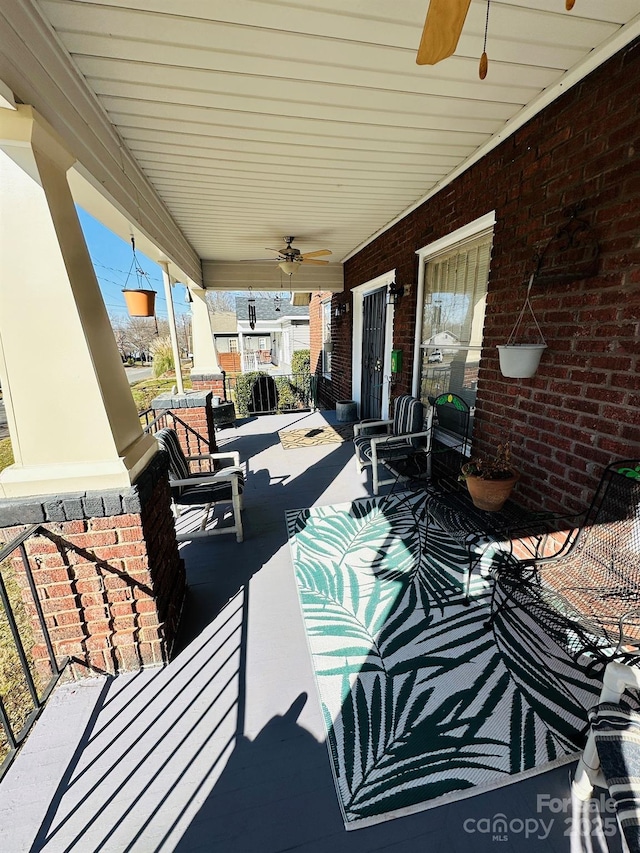 view of patio / terrace with ceiling fan and a porch