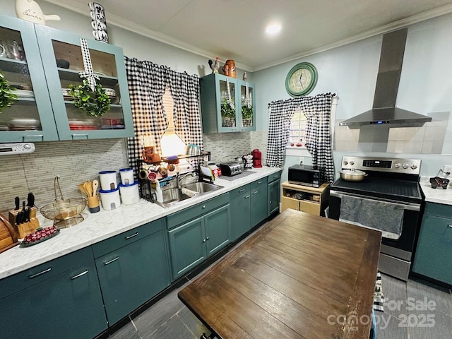 kitchen featuring stainless steel electric stove, extractor fan, tasteful backsplash, sink, and crown molding