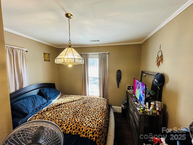 bedroom with ornamental molding