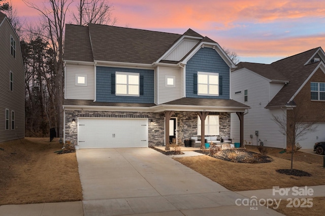 view of front of home with a garage and covered porch