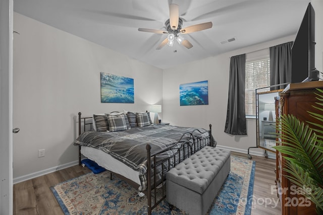 bedroom featuring ceiling fan and hardwood / wood-style floors