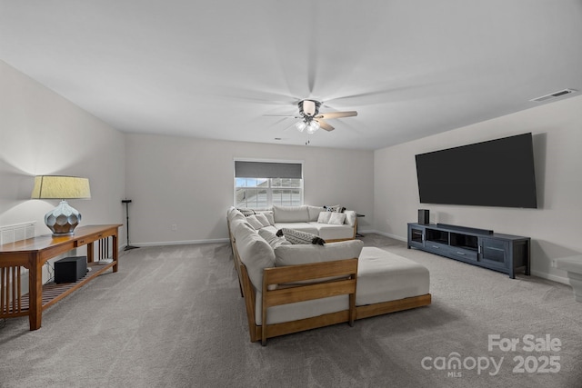 living room featuring carpet floors and ceiling fan