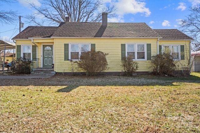 bungalow-style house featuring a front yard