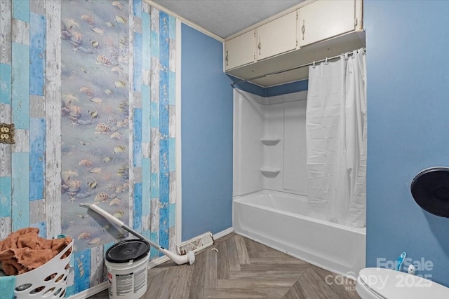 bathroom with toilet, crown molding, shower / bath combo with shower curtain, a textured ceiling, and parquet flooring