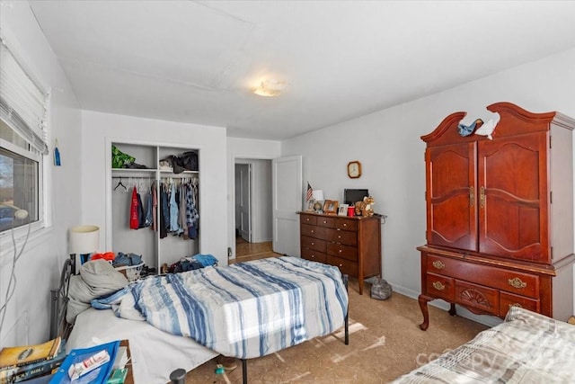 carpeted bedroom with a closet