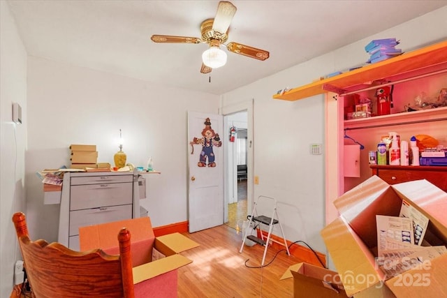 interior space with light wood-type flooring and ceiling fan