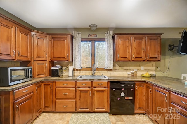 kitchen featuring black dishwasher, stainless steel microwave, a sink, and brown cabinets