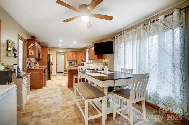 dining space featuring a ceiling fan and recessed lighting