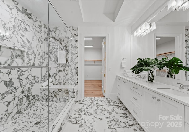 bathroom with vanity and an enclosed shower