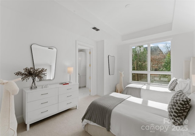 bedroom with light colored carpet