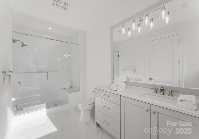 bathroom featuring vanity, toilet, and an enclosed shower