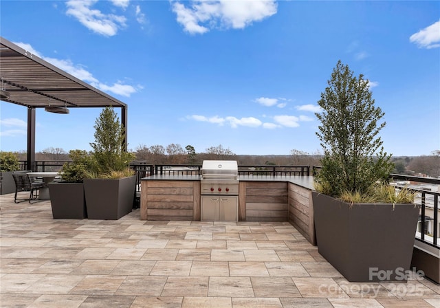 view of patio featuring an outdoor kitchen and grilling area