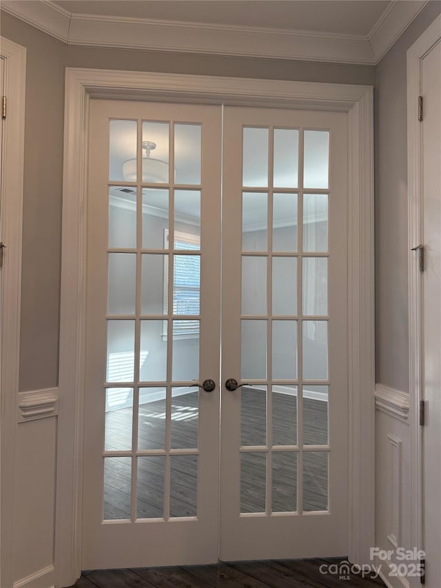 doorway to outside with french doors and crown molding